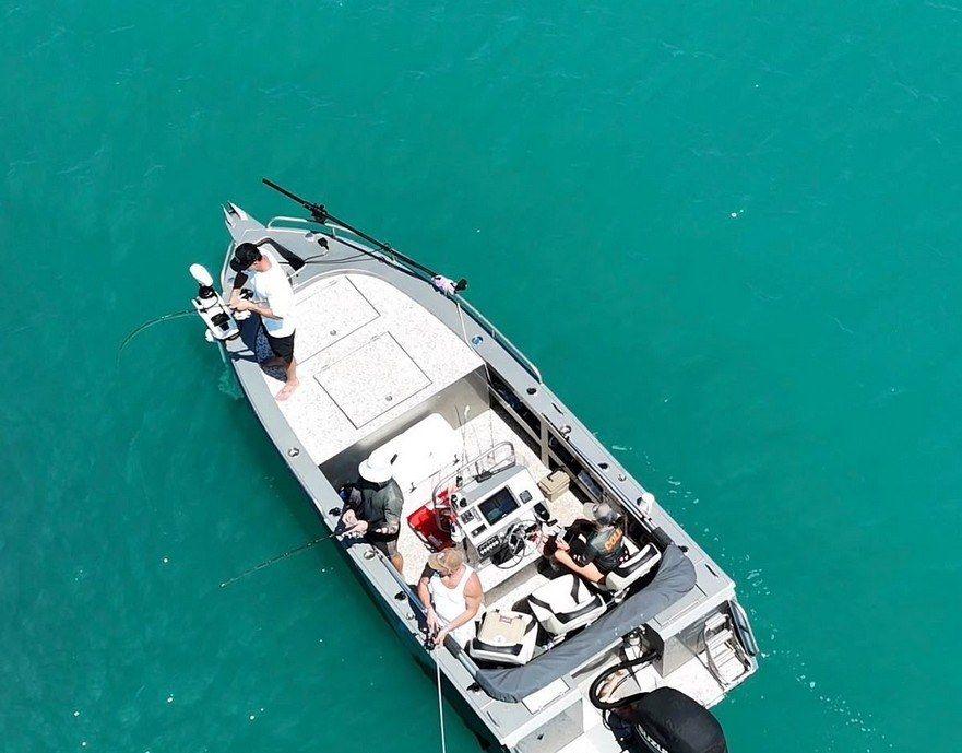 Aerial view of an Ultra V on turquoise water