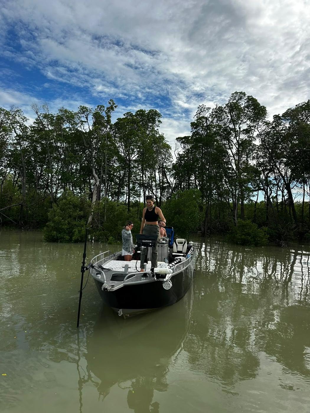 Angler casting from an Ultra V in green water